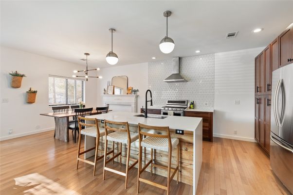 Dining room, Interior, Kitchen, Pendant Lights, Recessed Lighting, Stainless Steel Appliances, Wood Texture Flooring