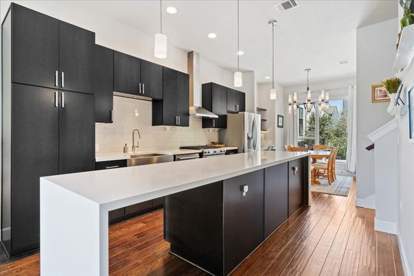Dining room, Interior, Kitchen, Pendant Lights, Recessed Lighting, Stainless Steel Appliances, Wood Texture Flooring