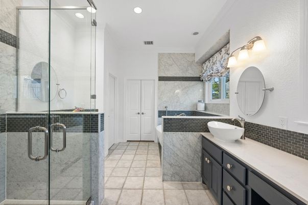 Bathroom, Dual Sink Vanities, Glass Shower, Interior, Marble Walls, Recessed Lighting