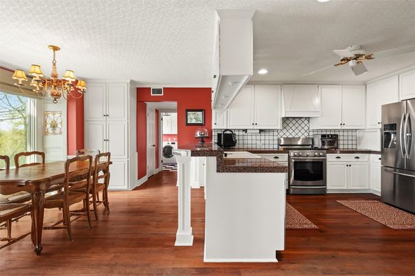 Chandelier, Dining room, Interior, Kitchen, Recessed Lighting, Tile Countertops, Wood Texture Flooring