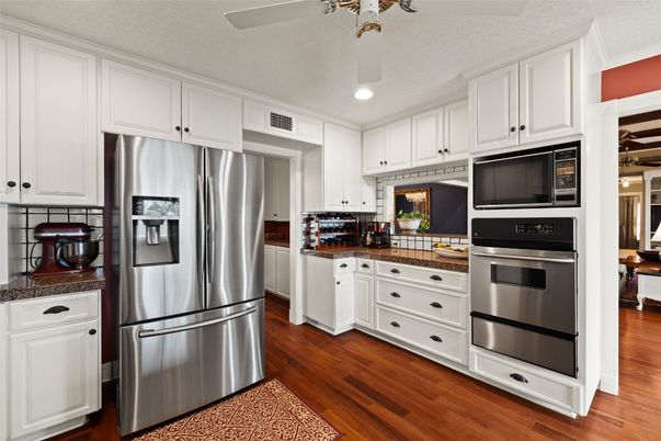 Interior, Kitchen, Recessed Lighting, Stainless Steel Appliances, Tile Countertops, Wood Texture Flooring