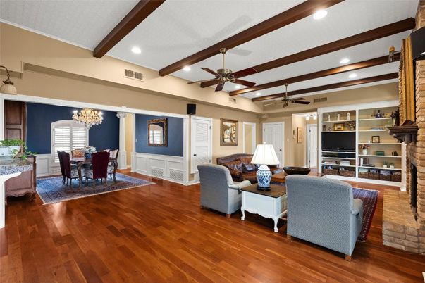 Chandelier, Dining room, Fireplace, Interior, Living room, Recessed Lighting, Wooden Beams, Wood Texture Flooring