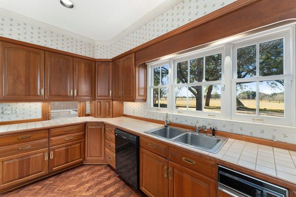 Interior, Kitchen, Recessed Lighting, Tile Countertops, Wood Texture Flooring