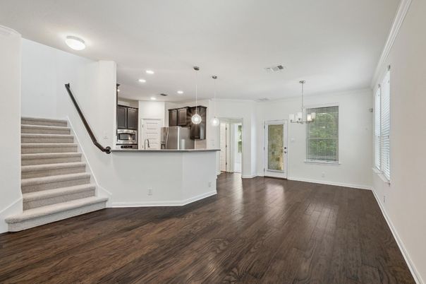 Empty room, Interior, Kitchen, Pendant Lights, Recessed Lighting, Stainless Steel Appliances, Wood Texture Flooring