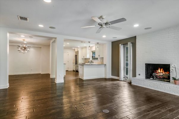 Empty room, Fireplace, Interior, Kitchen, Pendant Lights, Recessed Lighting, Stone Walls, Wood Texture Flooring