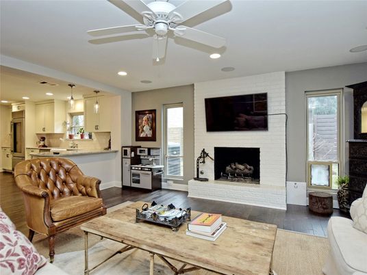 Fireplace, Interior, Kitchen, Living room, Pendant Lights, Recessed Lighting, Stainless Steel Appliances, Stone Walls, Wood Texture Flooring