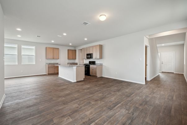 Empty room, Interior, Kitchen, Recessed Lighting, Stainless Steel Appliances, Wood Texture Flooring