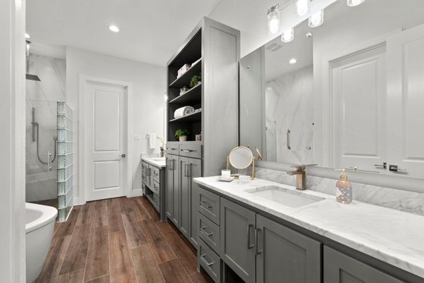 Bathroom, Dual Sink Vanities, Glass Shower, Interior, Marble Walls, Recessed Lighting, Wood Texture Flooring