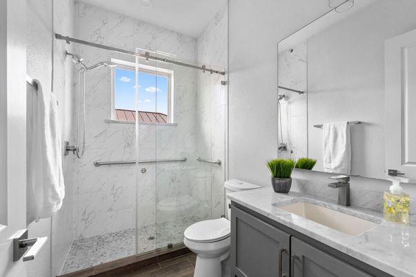 Bathroom, Glass Shower, Interior, Marble Walls, Recessed Lighting, Wood Texture Flooring