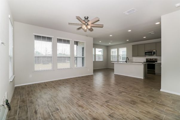 Empty room, Interior, Kitchen, Recessed Lighting, Stainless Steel Appliances, Wood Texture Flooring