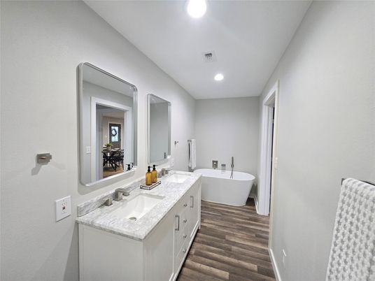 Bathroom, Dual Sink Vanities, Free Standing Baths, Interior, Recessed Lighting, Wood Texture Flooring
