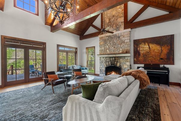 Chandelier, Fireplace, Interior, Living room, Piano, Stone Walls, Wooden Beams, Wooden Ceilings, Wood Texture Flooring