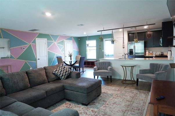 Dining room, Interior, Kitchen, Living room, Recessed Lighting, Stainless Steel Appliances, Wood Texture Flooring