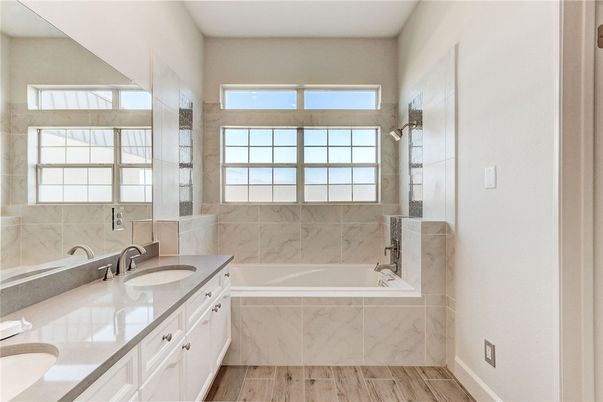 Bathroom, Dual Sink Vanities, Interior, Marble Walls, Wood Texture Flooring