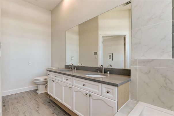 Bathroom, Dual Sink Vanities, Interior, Marble Walls, Wood Texture Flooring