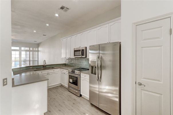 Interior, Kitchen, Recessed Lighting, Stainless Steel Appliances, Wood Texture Flooring