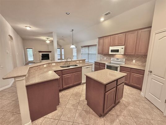 Fireplace, Interior, Kitchen, Pendant Lights, Recessed Lighting, Stainless Steel Appliances