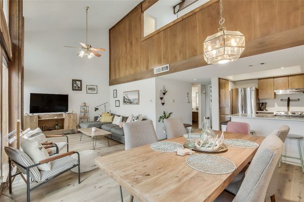 Chandelier, Dining room, Interior, Kitchen, Living room, Pendant Lights, Stainless Steel Appliances, Wood Texture Flooring