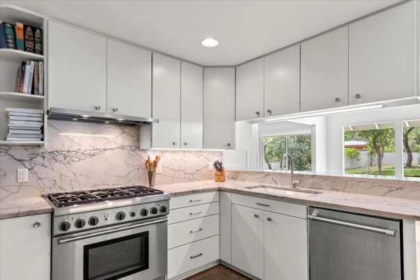 Interior, Kitchen, Marble Walls, Recessed Lighting, Stainless Steel Appliances