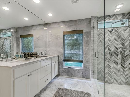 Bathroom, Dual Sink Vanities, Glass Shower, Interior, Marble, Marble Walls, Recessed Lighting