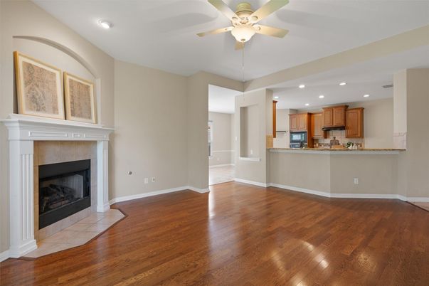 Empty room, Fireplace, Interior, Kitchen, Recessed Lighting, Wood Texture Flooring