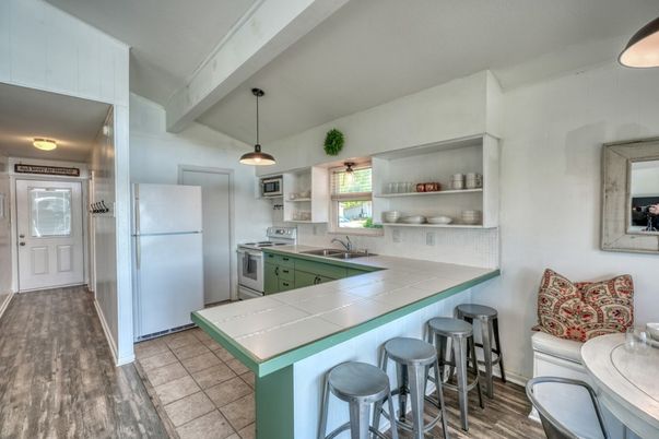 Interior, Kitchen, Pendant Lights, Tile Countertops, Wood Texture Flooring