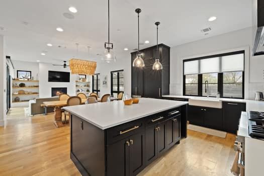 Chandelier, Dining room, Fireplace, Interior, Kitchen, Living room, Pendant Lights, Recessed Lighting, Stainless Steel Appliances, Wood Texture Flooring