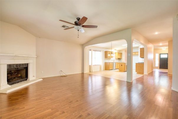 Chandelier, Empty room, Fireplace, Interior, Kitchen, Pendant Lights, Recessed Lighting, Wood Texture Flooring