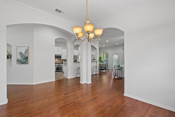 Chandelier, Dining room, Interior, Kitchen, Recessed Lighting, Stainless Steel Appliances, Wood Texture Flooring