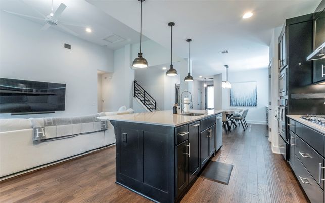 Dining room, Interior, Kitchen, Pendant Lights, Recessed Lighting, Stainless Steel Appliances, Wood Texture Flooring
