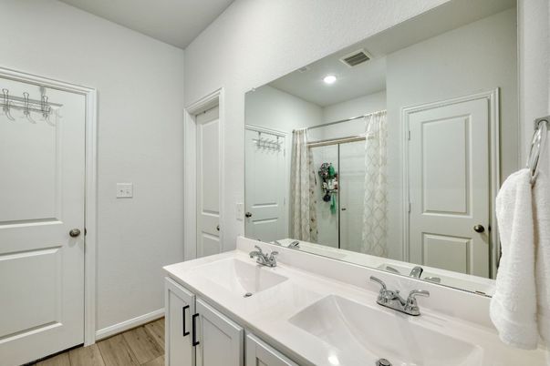 Bathroom, Dual Sink Vanities, Glass Shower, Interior, Recessed Lighting, Wood Texture Flooring