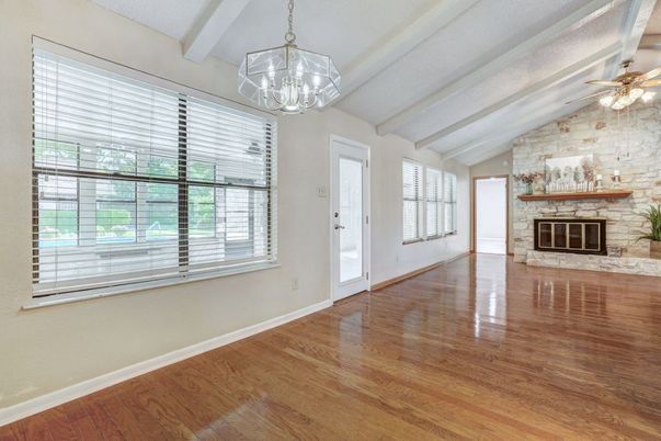 Chandelier, Empty room, Fireplace, Interior, Pendant Lights, Stone Walls, Wood Texture Flooring