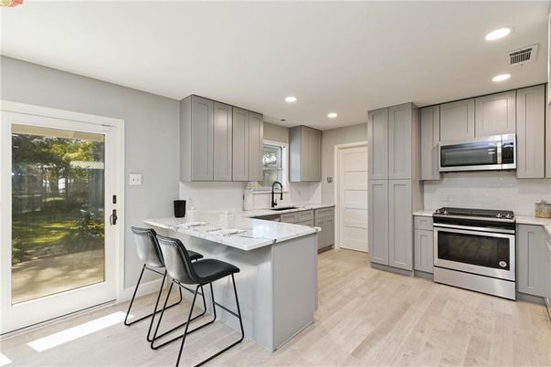 Interior, Kitchen, Recessed Lighting, Stainless Steel Appliances, Wood Texture Flooring