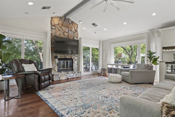 Fireplace, Interior, Living room, Recessed Lighting, Stone Walls, Wood Texture Flooring