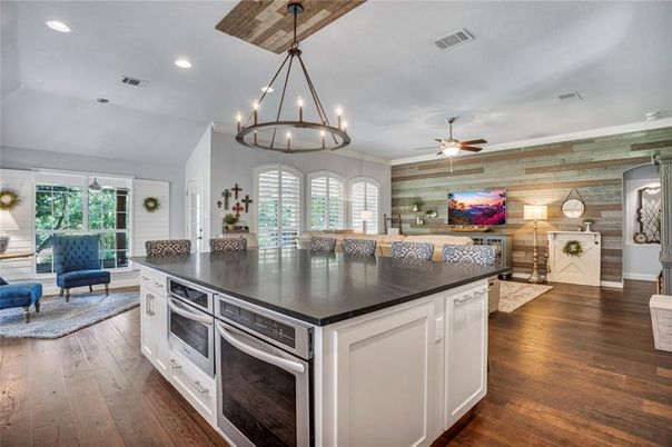 Chandelier, Interior, Kitchen, Living room, Pendant Lights, Recessed Lighting, Stainless Steel Appliances, Wood Texture Flooring