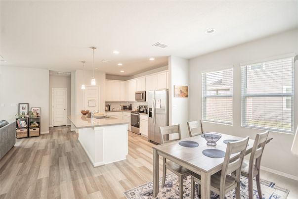 Dining room, Interior, Kitchen, Pendant Lights, Recessed Lighting, Stainless Steel Appliances, Wood Texture Flooring