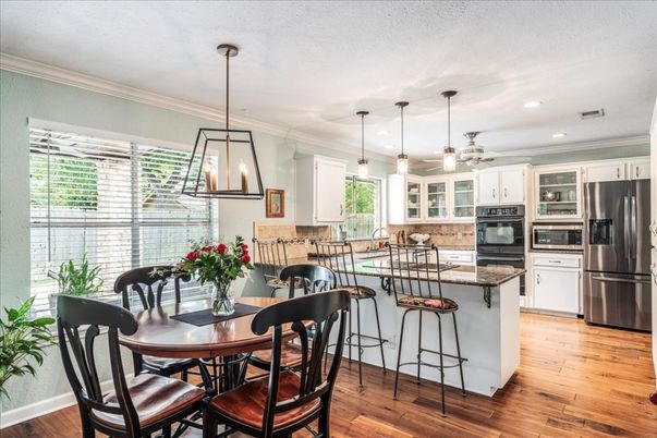 Dining room, Interior, Kitchen, Pendant Lights, Recessed Lighting, Stainless Steel Appliances, Wood Texture Flooring