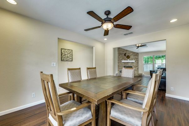 Dining room, Fireplace, Interior, Recessed Lighting, Stone Walls, Wood Texture Flooring