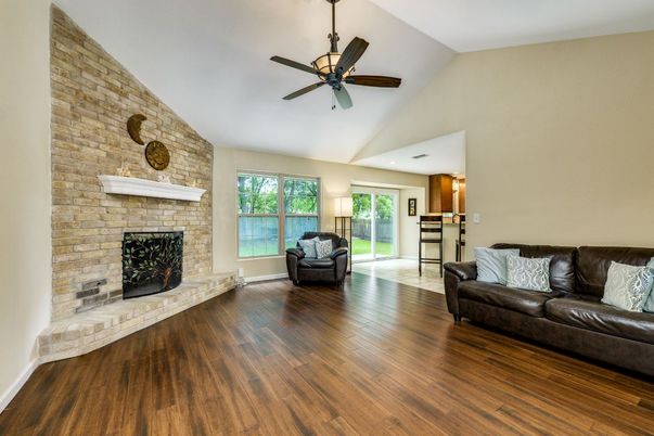 Fireplace, Interior, Living room, Recessed Lighting, Stone Walls, Wood Texture Flooring