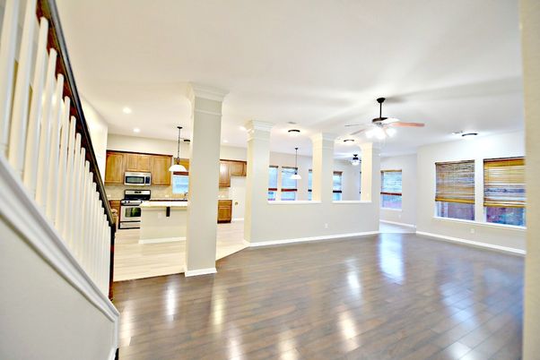 Empty room, Interior, Kitchen, Pendant Lights, Recessed Lighting, Stainless Steel Appliances, Wood Texture Flooring
