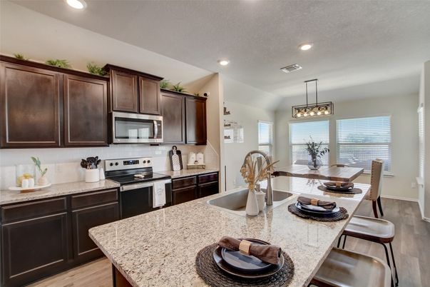 Dining room, Interior, Kitchen, Pendant Lights, Recessed Lighting, Stainless Steel Appliances, Wood Texture Flooring