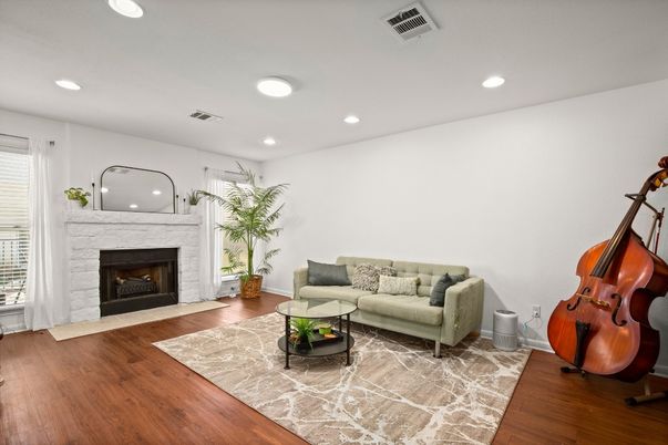 Fireplace, Interior, Living room, Piano, Recessed Lighting, Wood Texture Flooring