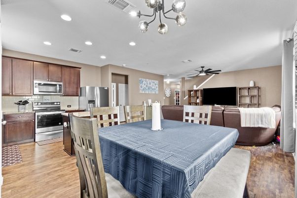 Dining room, Interior, Kitchen, Pendant Lights, Recessed Lighting, Stainless Steel Appliances, Wood Texture Flooring