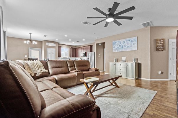 Chandelier, Dining room, Interior, Kitchen, Living room, Recessed Lighting, Stainless Steel Appliances, Wood Texture Flooring