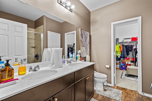 Bathroom, Dual Sink Vanities, Glass Shower, Interior, Walk-in Closets, Wood Texture Flooring