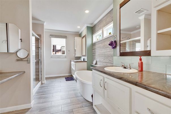 Bathroom, Dual Sink Vanities, Free Standing Baths, Glass Shower, Interior, Recessed Lighting, Wood Texture Flooring
