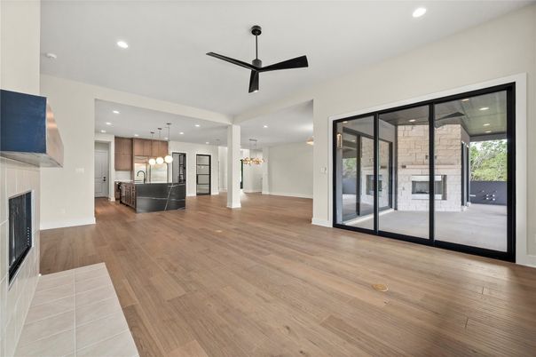 Empty room, Fireplace, Interior, Kitchen, Pendant Lights, Recessed Lighting, Wood Texture Flooring