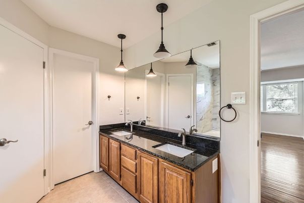 Bathroom, Dual Sink Vanities, Interior, Marble Walls, Pendant Lights, Wood Texture Flooring
