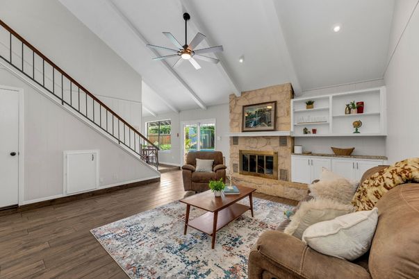 Fireplace, Interior, Living room, Recessed Lighting, Stone Walls, Wood Texture Flooring