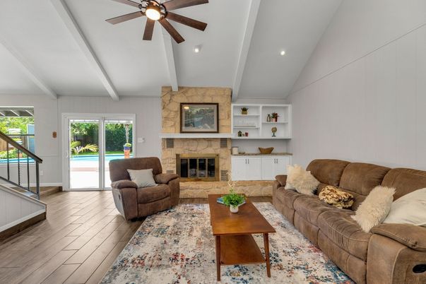 Fireplace, Interior, Living room, Recessed Lighting, Stone Walls, Wood Texture Flooring